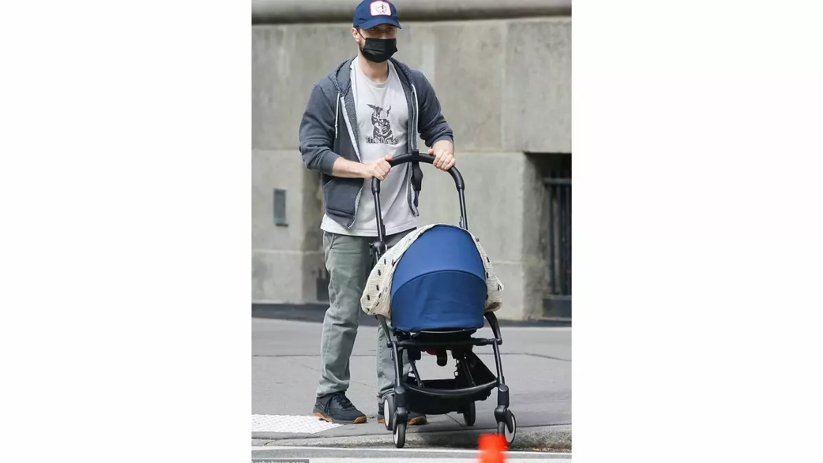 Daniel Radcliffe pushing baby stroller